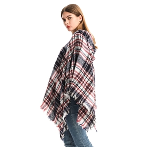 Women's plaid hooded poncho with tassels in classic red and black knit pattern