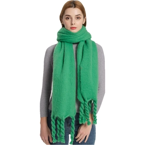 Neon green knit shawl featuring thick chunky braided tassel details for a winter look