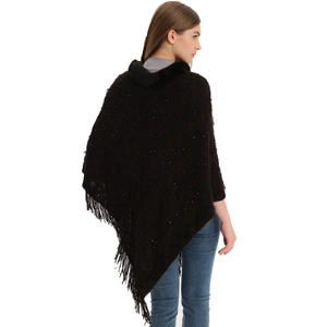 Knit poncho with faux fur collar and tassel trim featuring subtle sequins in dark brown