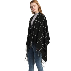Classic black and white checkered knit shawl with long tassels and open-front design
