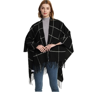Classic black and white plaid knit poncho with long tassels for women's autumn style