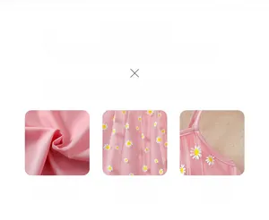 Detail of high-quality pink fabric with daisy floral embroidery and fine sewing craftsmanship
