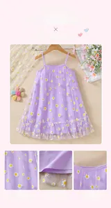 Detailed embroidery of white daisies on purple tulle fabric of a girls princess dress