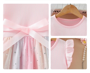 Détails du nœud rose et tulle dégradé étoilé sur robe de princesse pour fille