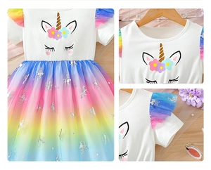 Detail of unicorn print and rainbow mesh skirt on short sleeve summer dress for girls