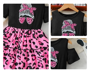 Detail of cold-shoulder sleeve and leopard print cartoon pattern on girl's summer dress