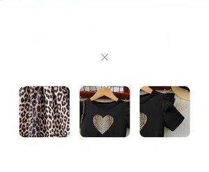 Detail of baby girl dress with leopard heart print and ruffled mesh sleeve texture
