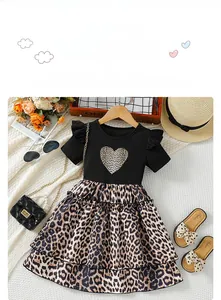 Detail of leopard print double-layered ruffle skirt with a heart graphic design