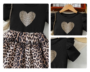 Detail of baby girl leopard print dress with ribbed fabric, ruffled sleeves and heart motif