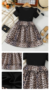 Detail of leopard print tulle skirt and ruffled sleeves on kids summer dress