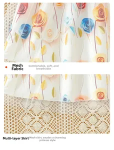 Detailed close-up of layered floral mesh fabric and ruffled hem on summer dress