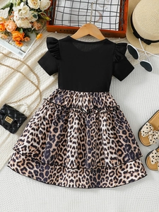 Girls summer dress featuring black ribbed bodice and layered leopard print tulle skirt