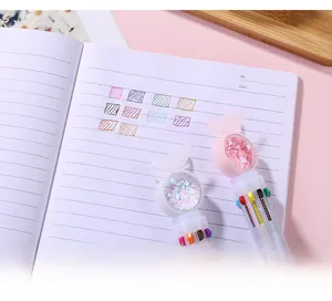 Detail of 10-color retractable ballpoint pen with sequin butterfly topper and pink accents