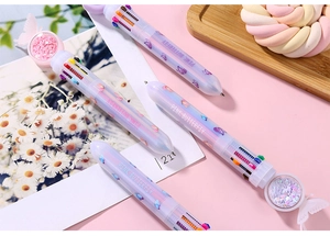 Close-up of pink butterfly 10-color shuttle pen with glitter sequins and top charm