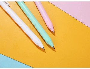 Close-up of matte macaron gel pens in white, mint green, and pink with metal tips