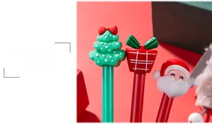 Close-up of cute 3D silicone Christmas pens with Santa, reindeer and tree toppers