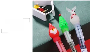 Detail of Christmas multi-color pens with cute Santa, tree and reindeer soft toppers