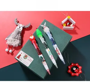 Close-up of a Christmas three-piece ballpoint pen set with Santa and reindeer motifs