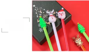 Detail of 3D cartoon Christmas pens with Santa, snowman and reindeer silicone caps