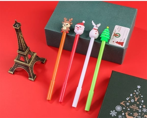 Set of four Christmas gel pens featuring cartoon Santa, reindeer, snowman and tree toppers
