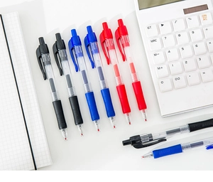 Close-up of retractable gel pens in red, blue, and black with anti-slip rubber grips
