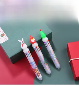 Three Christmas 10-color shuttle pens with Santa and reindeer toppers on a festive box