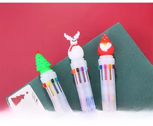 Detailed view of 10-color Christmas pens featuring Santa, reindeer, and tree toppers