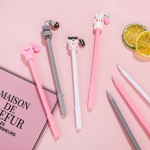 Cute animal theme neutral pens with silicone pig and cat charms on pink background
