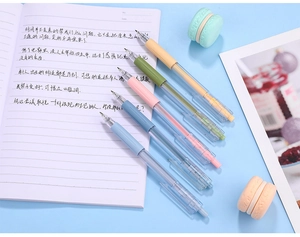 Close-up of five macaron colored retractable pens with ergonomic soft rubber grips