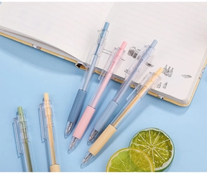 Close-up of assorted colorful 0.5mm retractable gel pens with soft rubber grips for writing