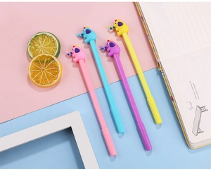 Close-up of set of four colorful cartoon elephant pens in pink blue purple and yellow