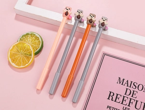 Detailed view of four cartoon squirrel neutral pens in soft pink and grey office setting
