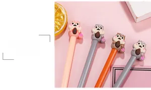 Close-up of cute 3D silicone squirrel toppers on colorful gel pens with nuts