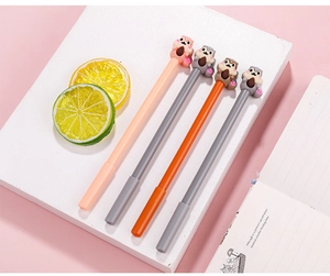 Close-up of four cute cartoon squirrel gel pens on a white stone stand with soft background