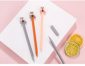 Detailed close-up of cute 3D squirrel toppers on colorful gel pens with fine tips