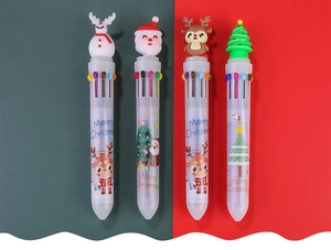 Macro view of Christmas ballpoint pens showing snowman, Santa, and reindeer toppers