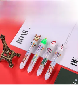 Close-up of four Christmas 10-color ballpoint pens with Santa and Reindeer toppers