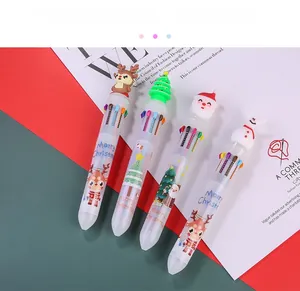 Detail of Christmas multi-color ballpoint pens with cartoon reindeer and Santa toppers