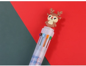 Macro detail of Christmas 10-color ballpoint pen with 3D reindeer topper and festive text