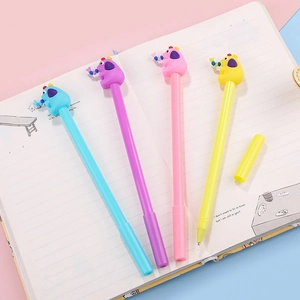 Cute cartoon elephant gel pens in four pastel colors on a notebook for school and office