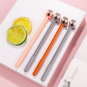 Set of four creative cartoon squirrel gel pens in orange and grey on a desk