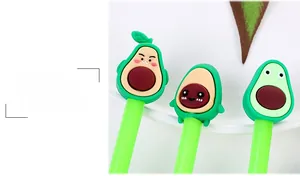 Close-up of cute avocado pens with 3D cartoon expressions on a clean white desk