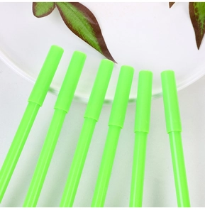 Close-up of bright green avocado neutral pens arranged in a creative radial layout