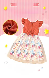 Detail of girls' summer dress showing orange knit bodice and floral mesh skirt