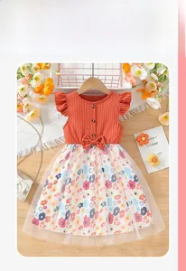 Detail of girls' summer dress with orange knit bodice, ruffle sleeves and floral mesh skirt