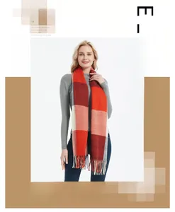 Close-up of red and beige checkered tassel scarf with soft cashmere-like texture