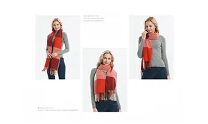 Detail shot of multi-color plaid scarf with long fringes in red orange and cream