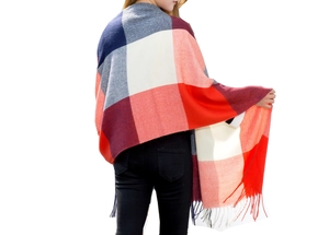 Detailed back view of a thick red and navy plaid scarf with long fringe tassels