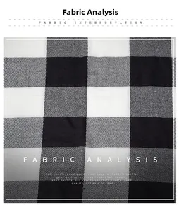 Detailed close-up of soft black and white plaid fabric with a premium twill weave pattern