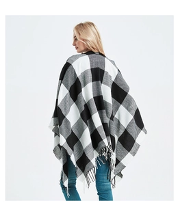 Detailed back view of women's black and white buffalo plaid shawl with fringe tassels